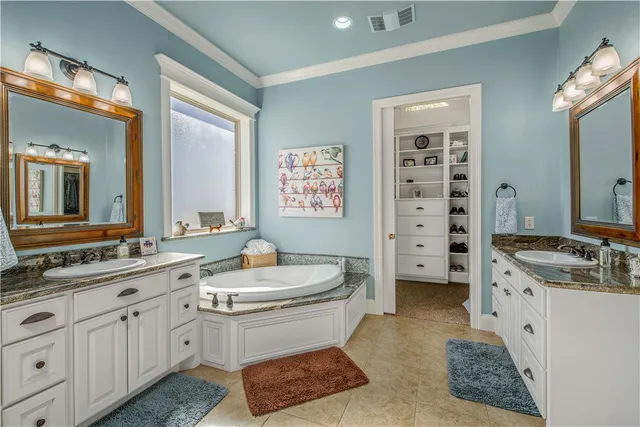 a bedroom with a bed wooden floor and window