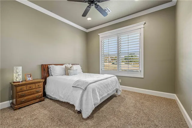 a living room with furniture and large windows