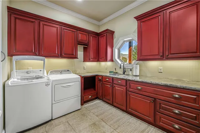 a bathroom with a granite countertop sink a toilet and a mirror