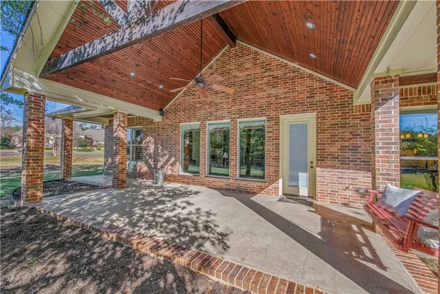 a bathroom with a toilet a sink and a mirror