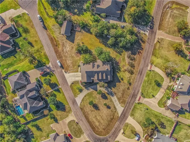 a view of a swimming pool with an outdoor space and seating area