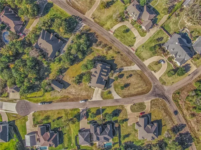 an aerial view of a house with swimming pool