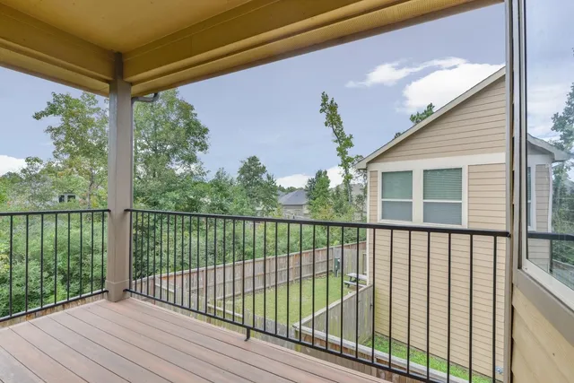 a view of balcony with wooden floor