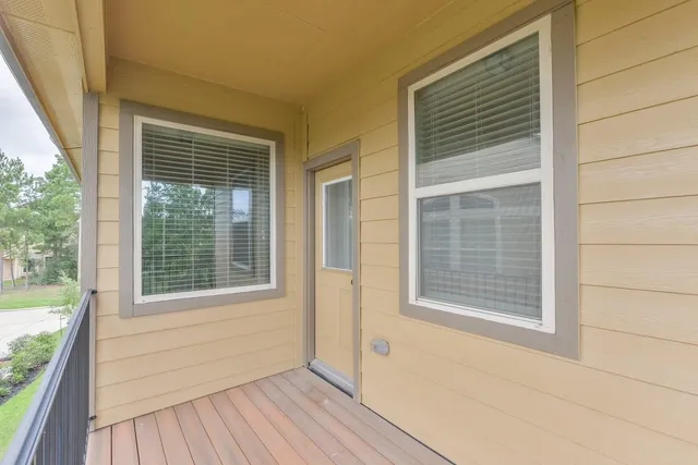 a view of a house that has wooden floor and a window