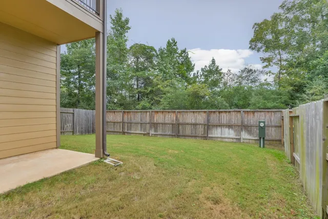 a view of a backyard with a small cabin