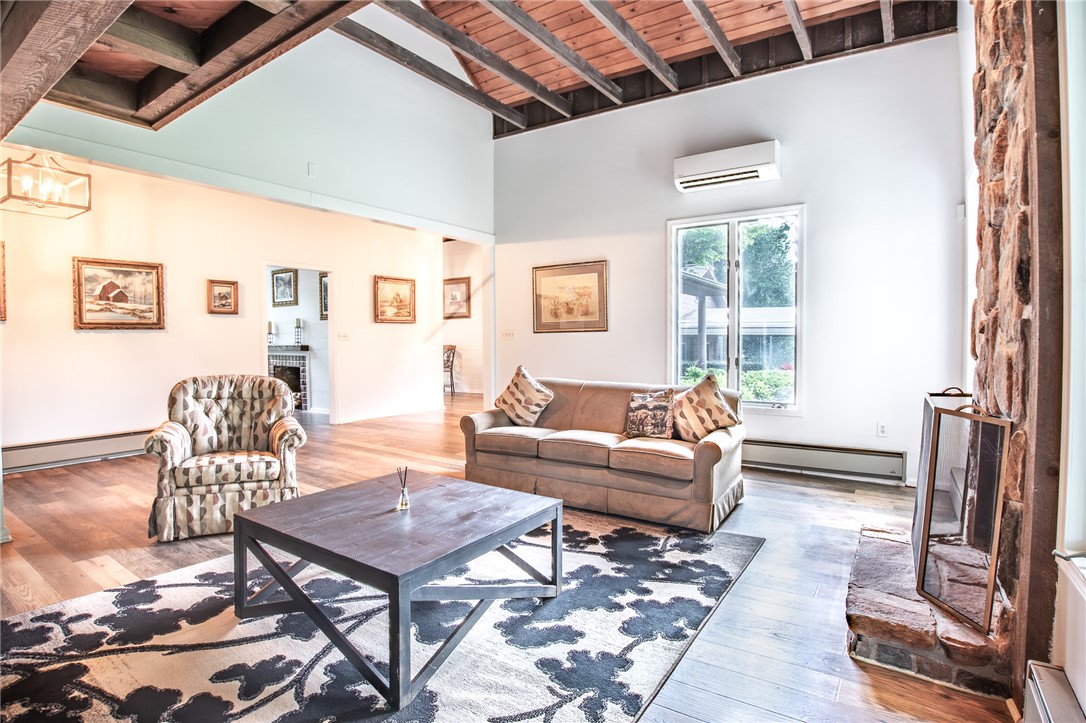 200 Chenault Road Townville, SC 29689 - Photo 6 of 47 Exposed wood beams add architectural interest to this airy living room.