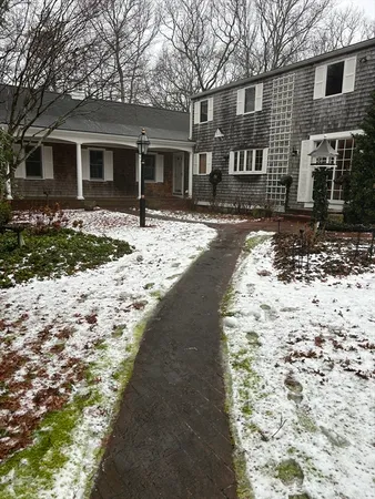 a front view of a house with a yard
