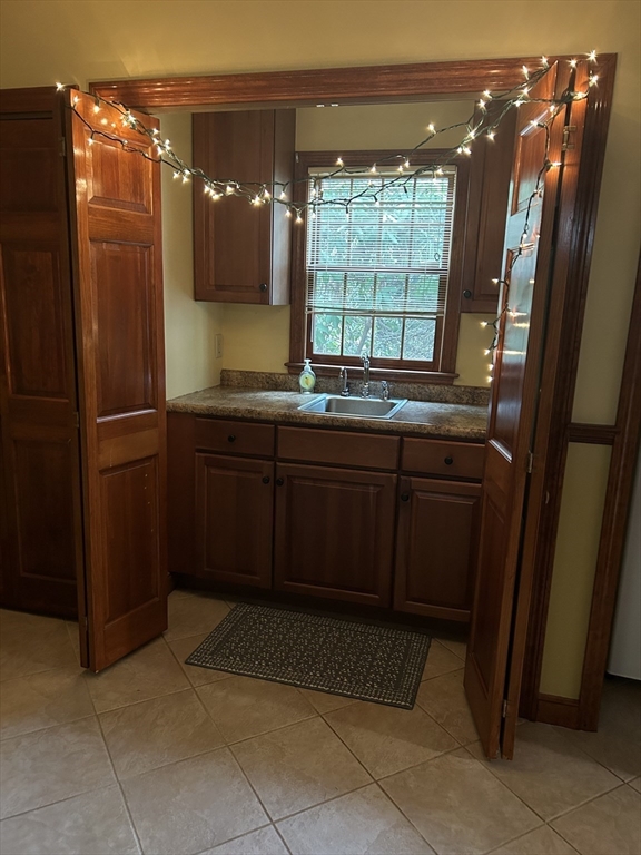 200 Plympton Road, Unit 200 Plymouth, MA 02360 - Photo 8 of 10 a bathroom with a sink and mirror