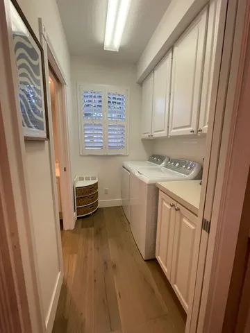 a utility room with a sink a washer and dryer