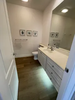 a bathroom with a sink and mirror