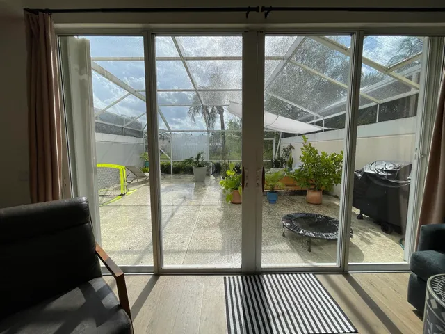 a view of a glass door with a balcony