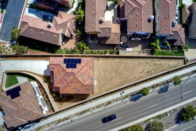 an aerial view of a house with outdoor space