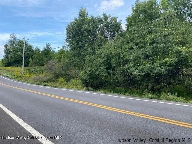 a view of a yard and basketball court