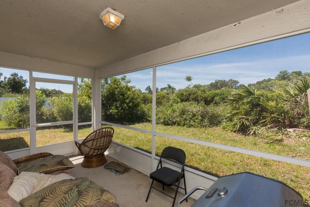 23 Freneau Lane Palm Coast, FL 32137 - Photo 36 of 44 Screened Back Porch