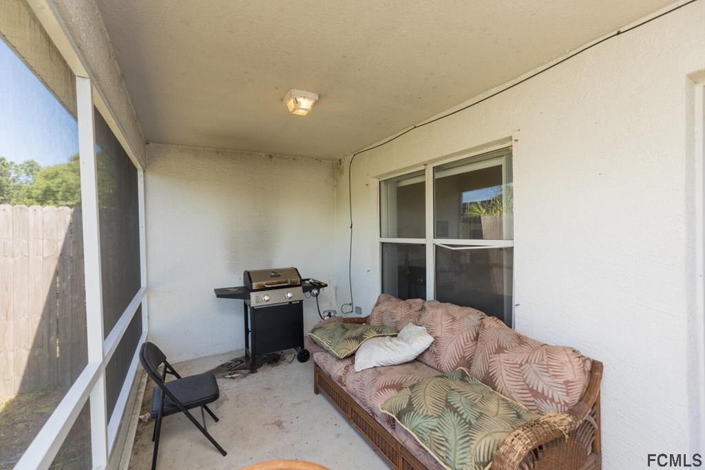 23 Freneau Lane Palm Coast, FL 32137 - Photo 37 of 44 Screened Back Porch