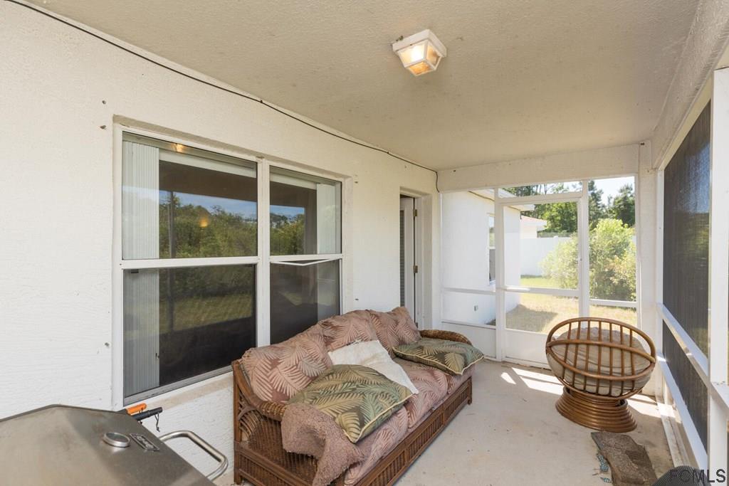 23 Freneau Lane Palm Coast, FL 32137 - Photo 38 of 44 Screened Back Porch