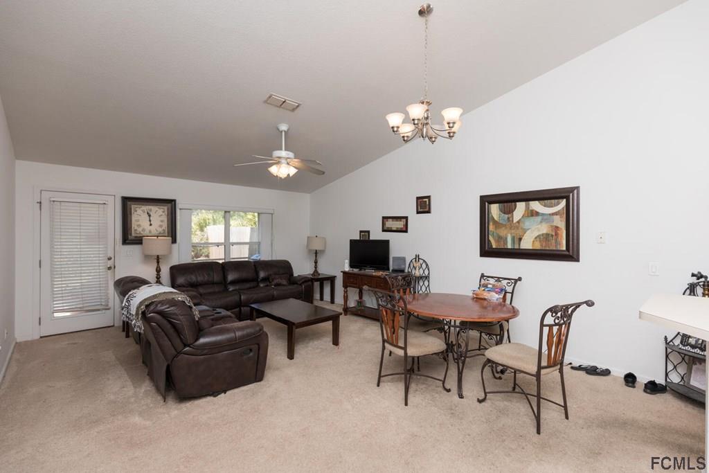 23 Freneau Lane Palm Coast, FL 32137 - Photo 9 of 44 Open Living Room Dining Room