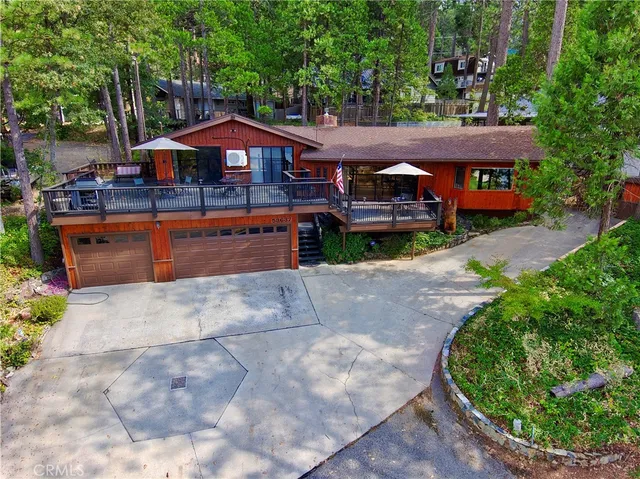 a front view of a house with a yard table and chairs