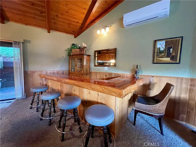 a room with furniture and pool table