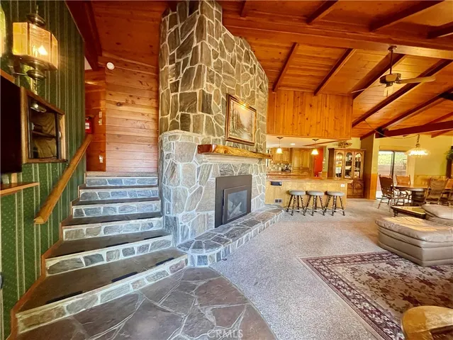 a bedroom with bed and wooden floor