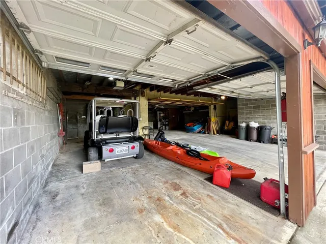 a view of a yard with truck parked on the road