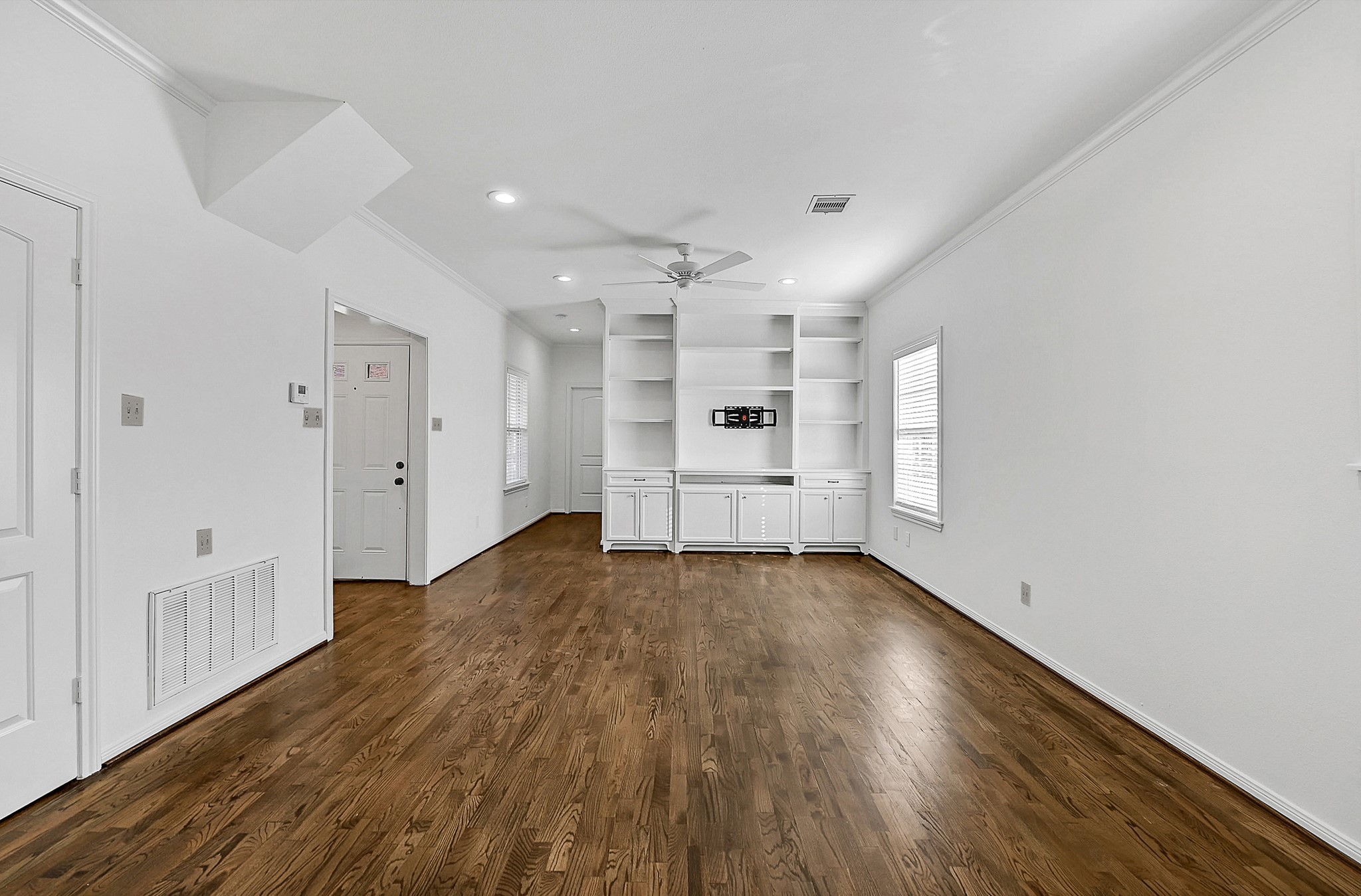 1959 Knoll Street Houston, TX 77080 - Photo 22 of 22 View from dining shows open floor-plan and custom built-ins.