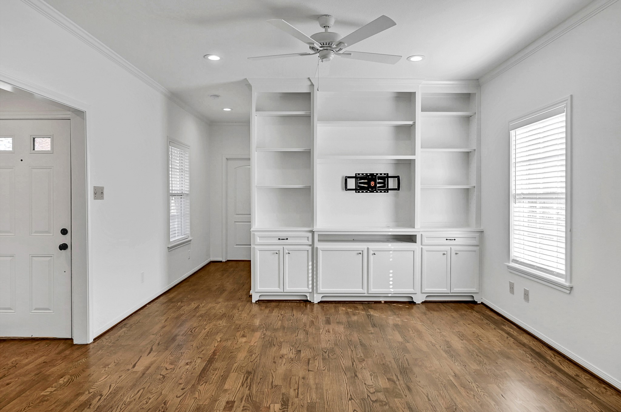 1959 Knoll Street Houston, TX 77080 - Photo 12 of 22 Custom built-ins offer plenty of storage space and place to mount a TV.