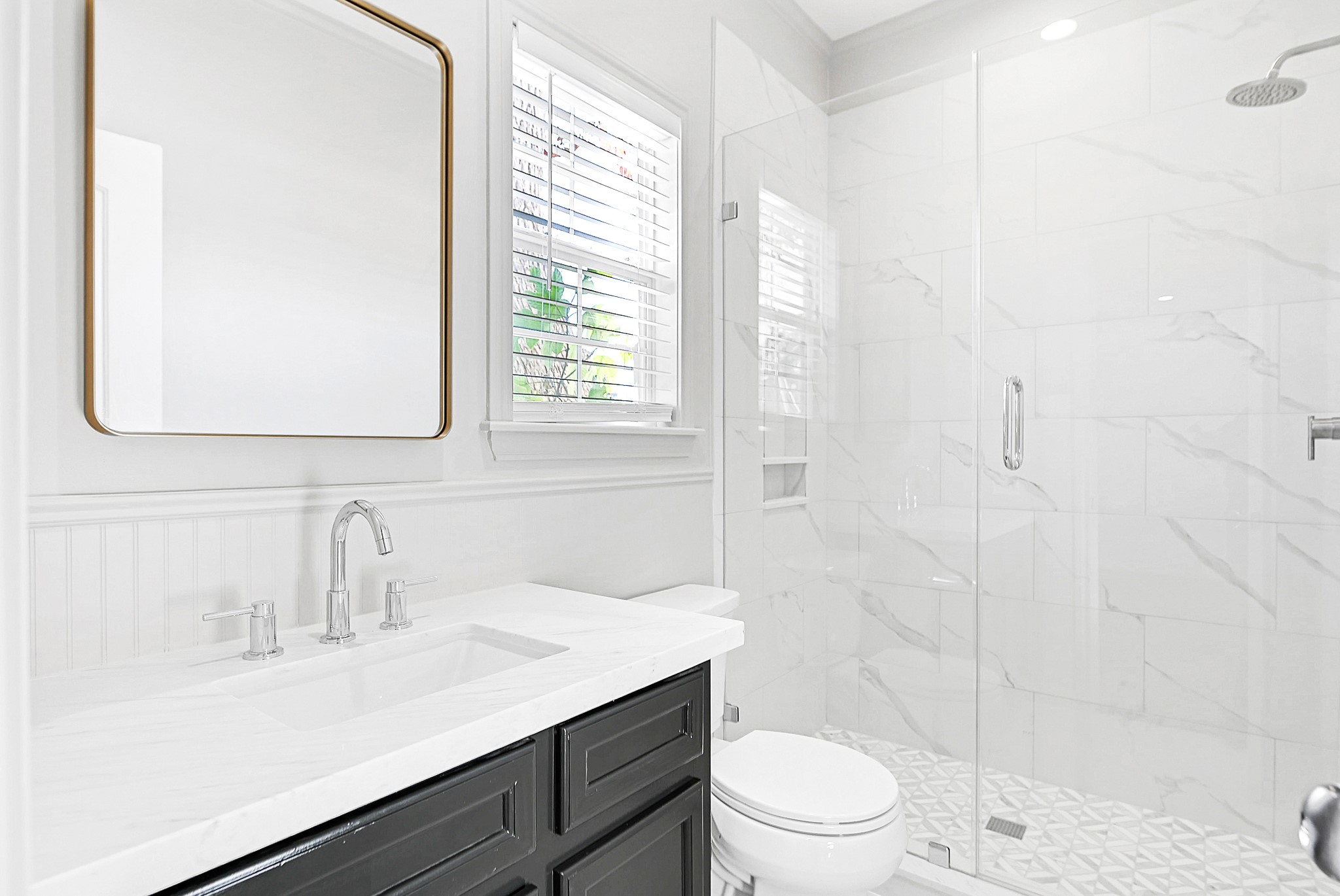 1959 Knoll Street Houston, TX 77080 - Photo 19 of 22 Bathroom was just updated with walk-in shower, quartz countertop and decorative mirror.