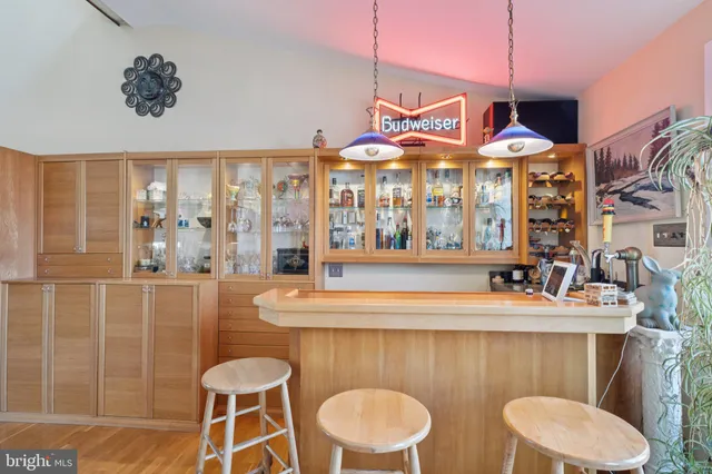 a bathroom with a sink a mirror and a bathtub