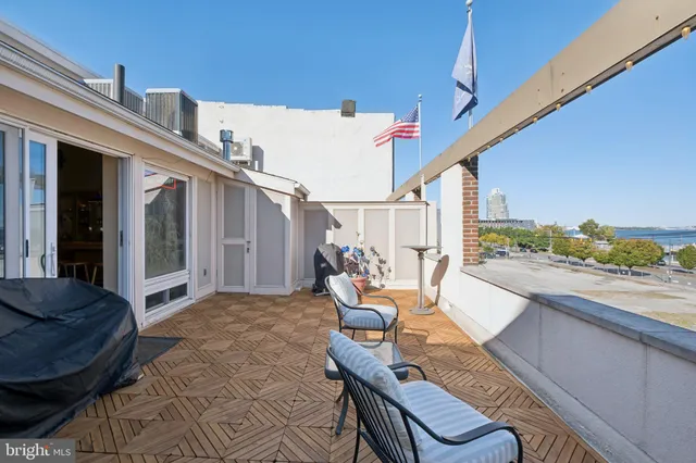 a view of balcony with furniture