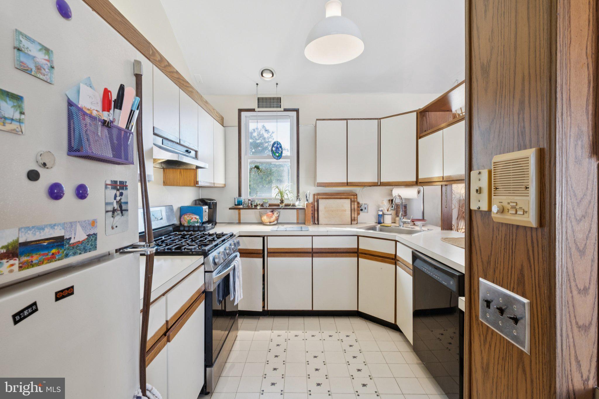 315 North Front Street, Unit 315 Philadelphia, PA 19106 - Photo 17 of 39 a kitchen with stainless steel appliances granite countertop a sink stove and refrigerator