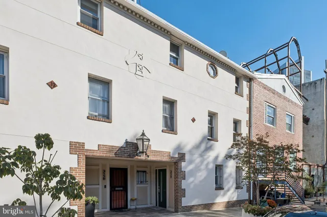 a work room with furniture and a bookshelf