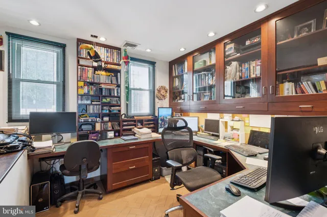a view of living room with furniture and book shelf