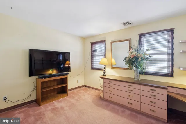 a room with a sink and a mirror