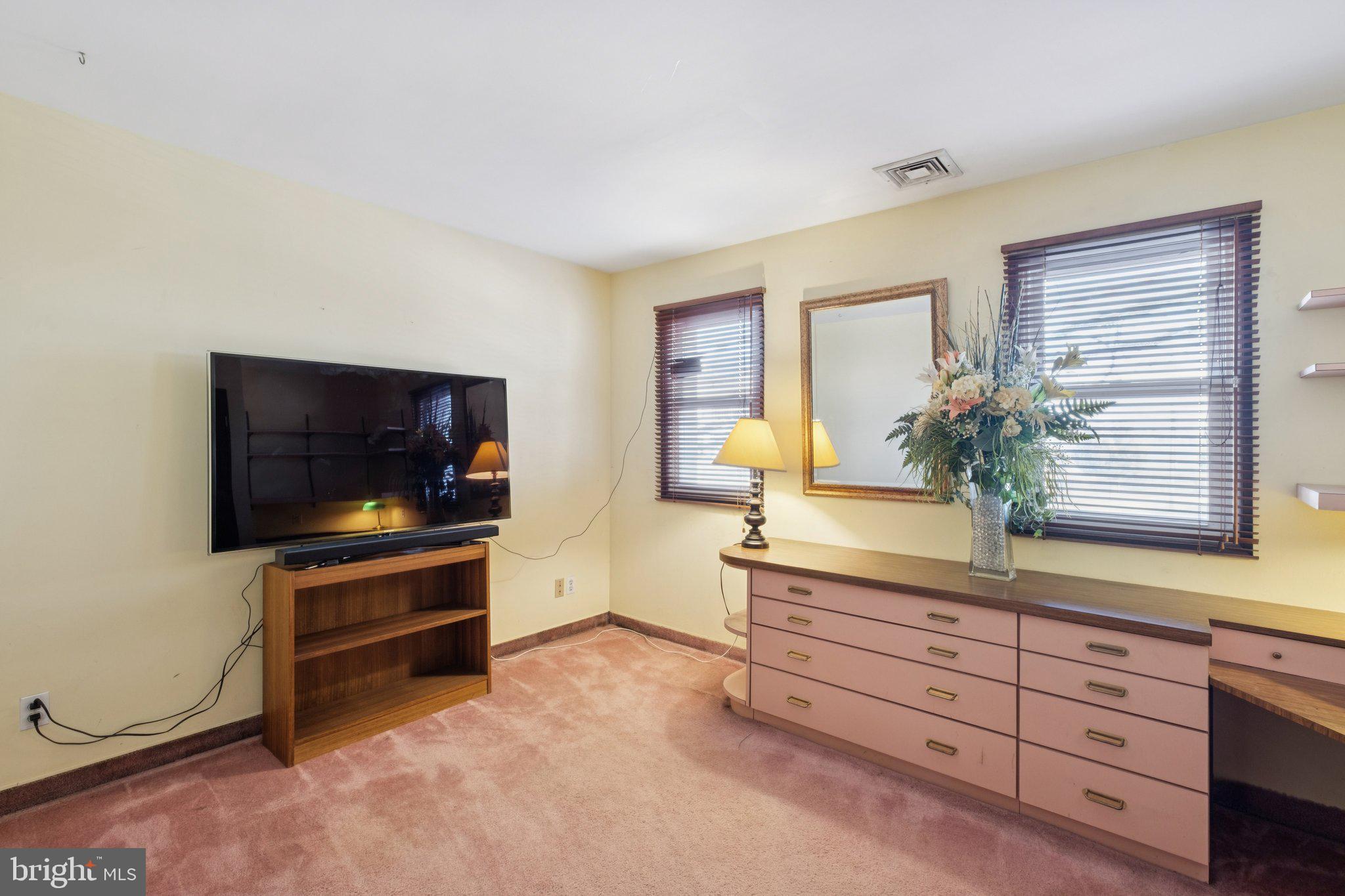 315 North Front Street, Unit 315 Philadelphia, PA 19106 - Photo 28 of 39 a living room with furniture and a flat screen tv