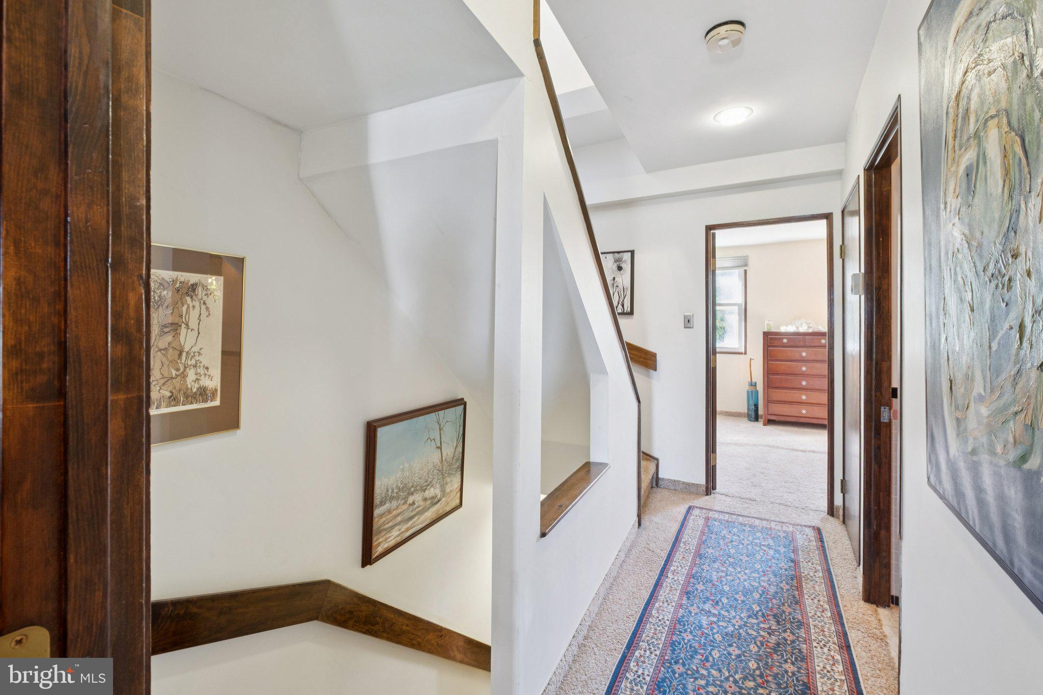 315 North Front Street, Unit 315 Philadelphia, PA 19106 - Photo 31 of 39 a view of a hallway with wooden floor and stairs