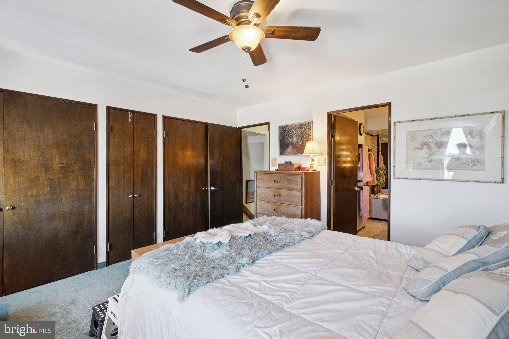 315 North Front Street, Unit 315 Philadelphia, PA 19106 - Photo 34 of 39 a bedroom with a bed and a chandelier