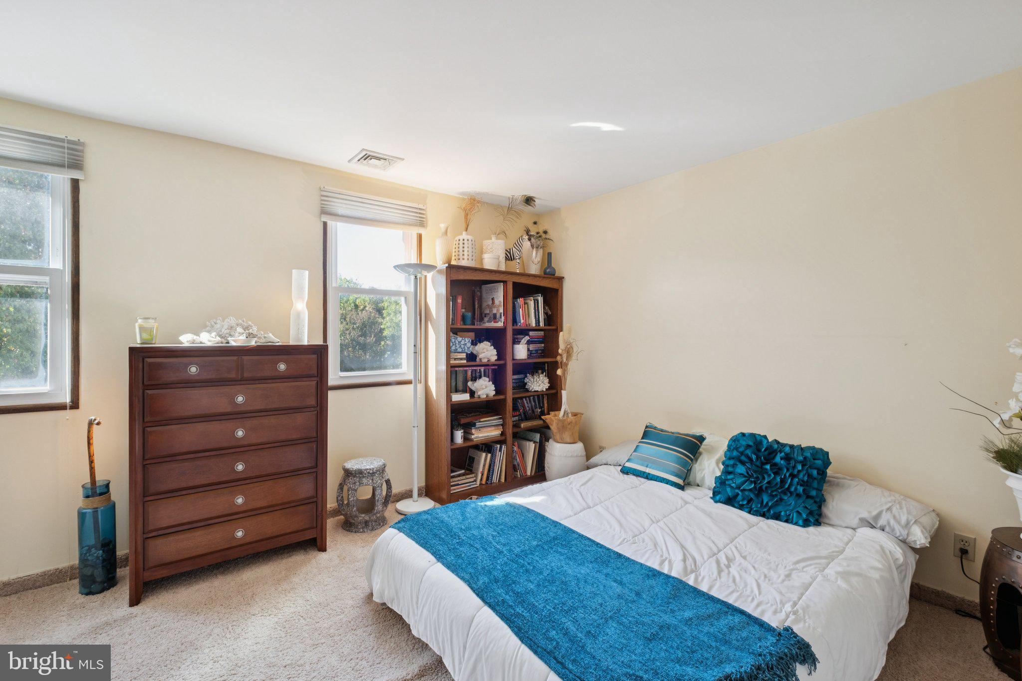 315 North Front Street, Unit 315 Philadelphia, PA 19106 - Photo 5 of 39 a bedroom with a bed and a bookshelf