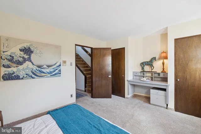 a kitchen with stainless steel appliances kitchen island granite countertop a refrigerator and a sink