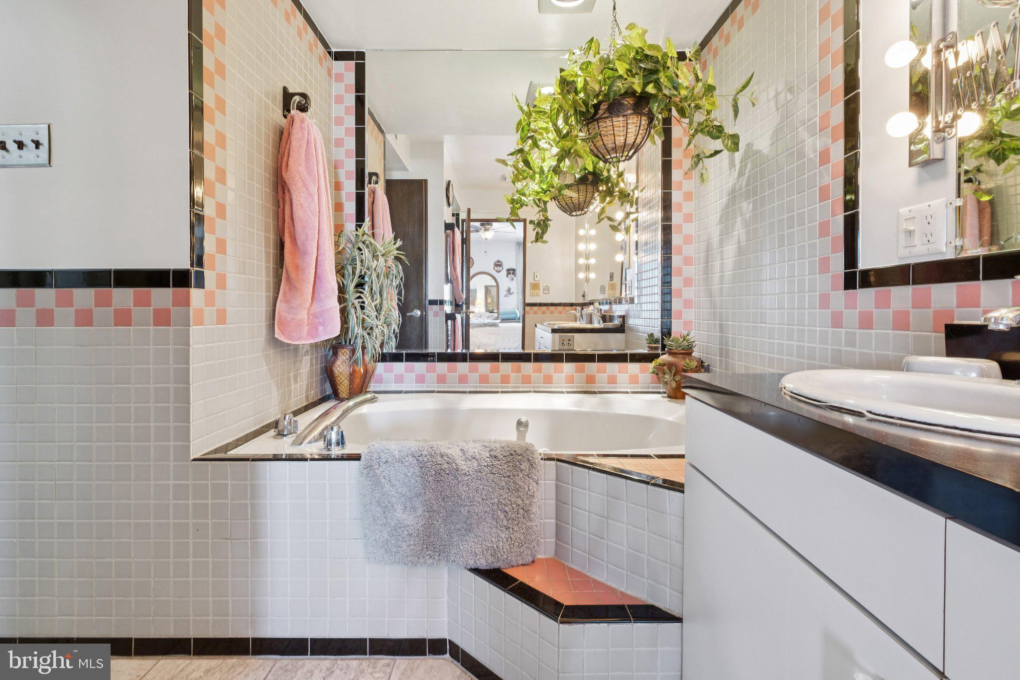 315 North Front Street, Unit 315 Philadelphia, PA 19106 - Photo 9 of 39 a bathroom with a sink and a mirror
