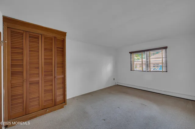 a view of empty room with windows