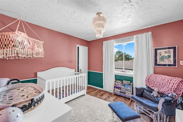 a bedroom with furniture and a window