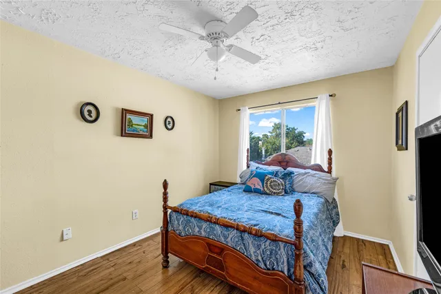 a bedroom with a bed and a table in it