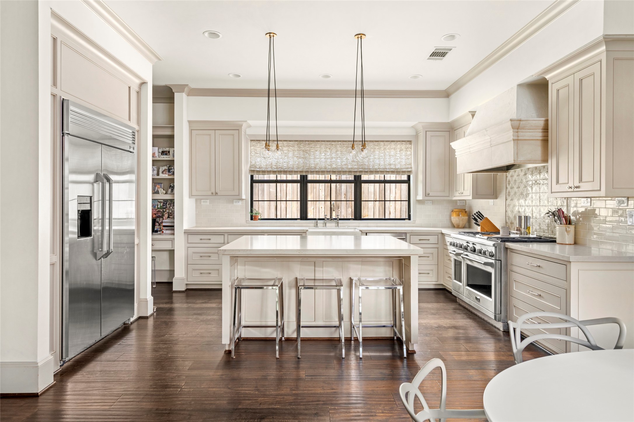 2216 Stanmore Drive Houston, TX 77019 - Photo 22 of 46 A well-appointed kitchen with a large center island, GE Monogram range and refrigerator, new Bosch dishwasher, new GE microwave, and expansive counter space for both cooking and gathering.