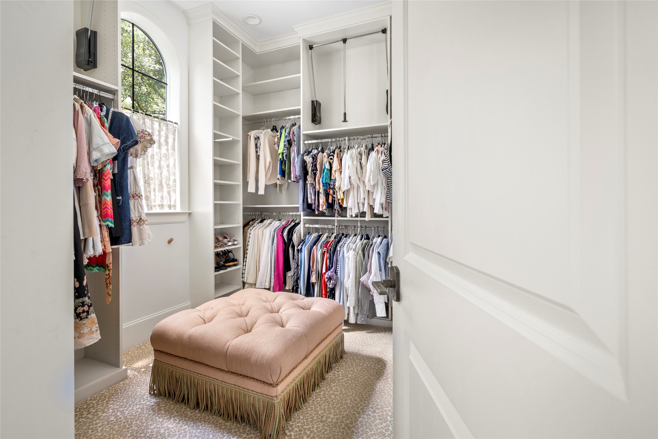 2216 Stanmore Drive Houston, TX 77019 - Photo 32 of 46 Beautifully-lit primary closet 2 features custom built-ins and plush carpeting.