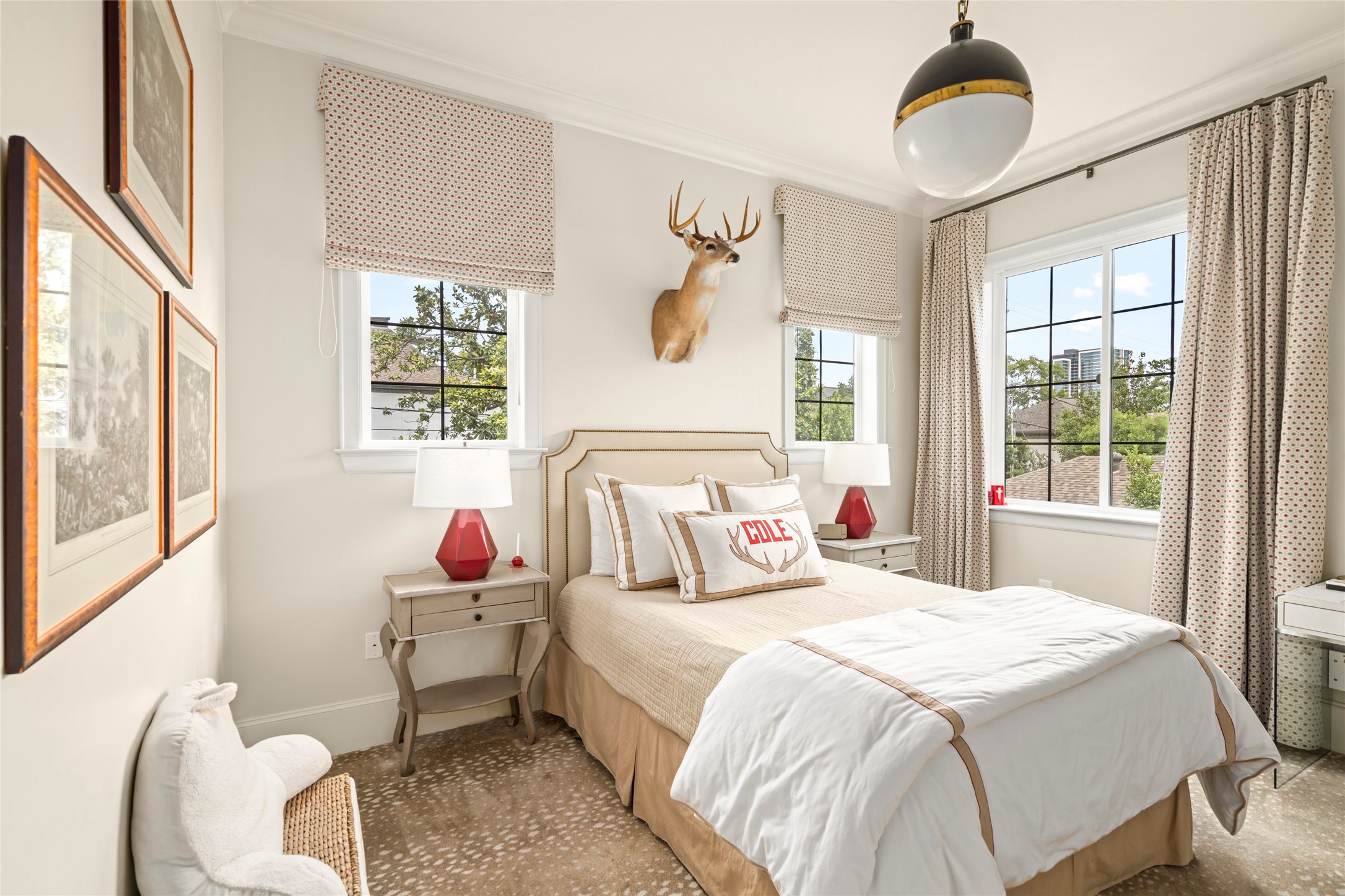 2216 Stanmore Drive Houston, TX 77019 - Photo 35 of 46 Bright secondary bedroom with multiple windows, tailored window treatments, neutral finishes, and an en-suite layout for comfort and privacy.