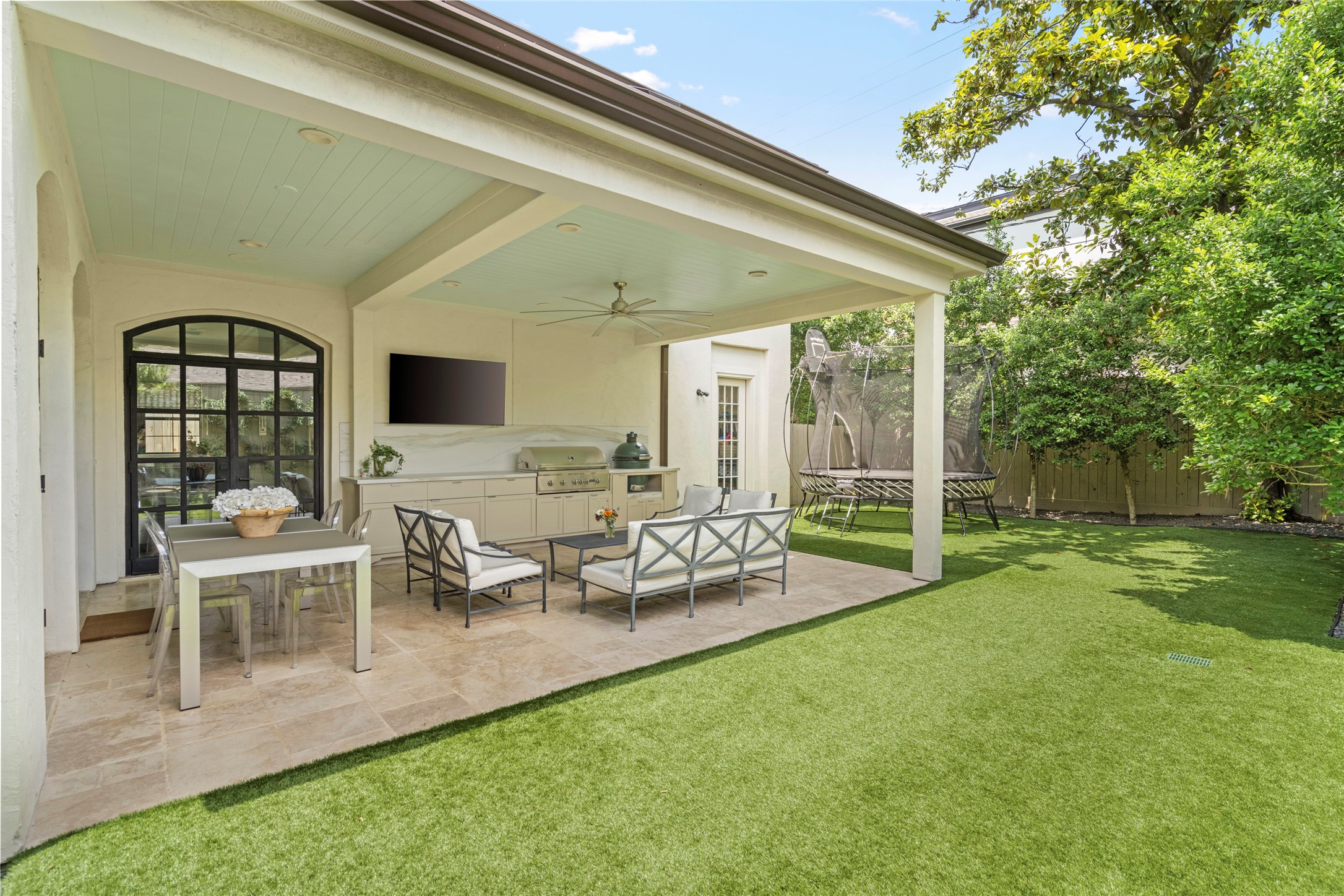 2216 Stanmore Drive Houston, TX 77019 - Photo 42 of 46 The newly extended roofline and metal roof detail create a true outdoor room with space for dining, lounging, and enjoying the backyard.