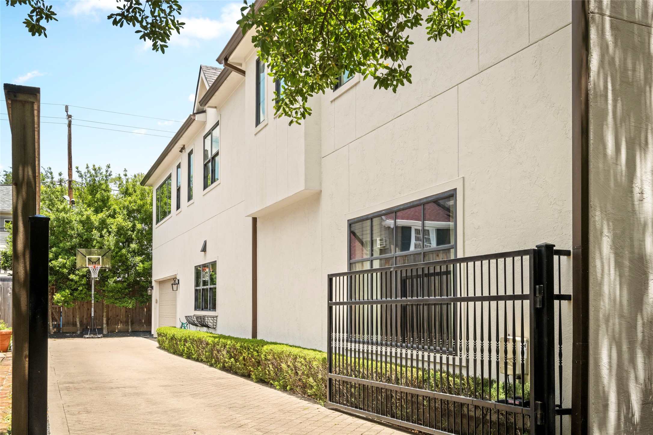 2216 Stanmore Drive Houston, TX 77019 - Photo 45 of 46 Private gated drive with motor-court space, landscaped borders, and direct access to the garage and rear grounds.