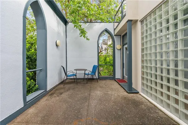 a view of a house with a porch and a tub