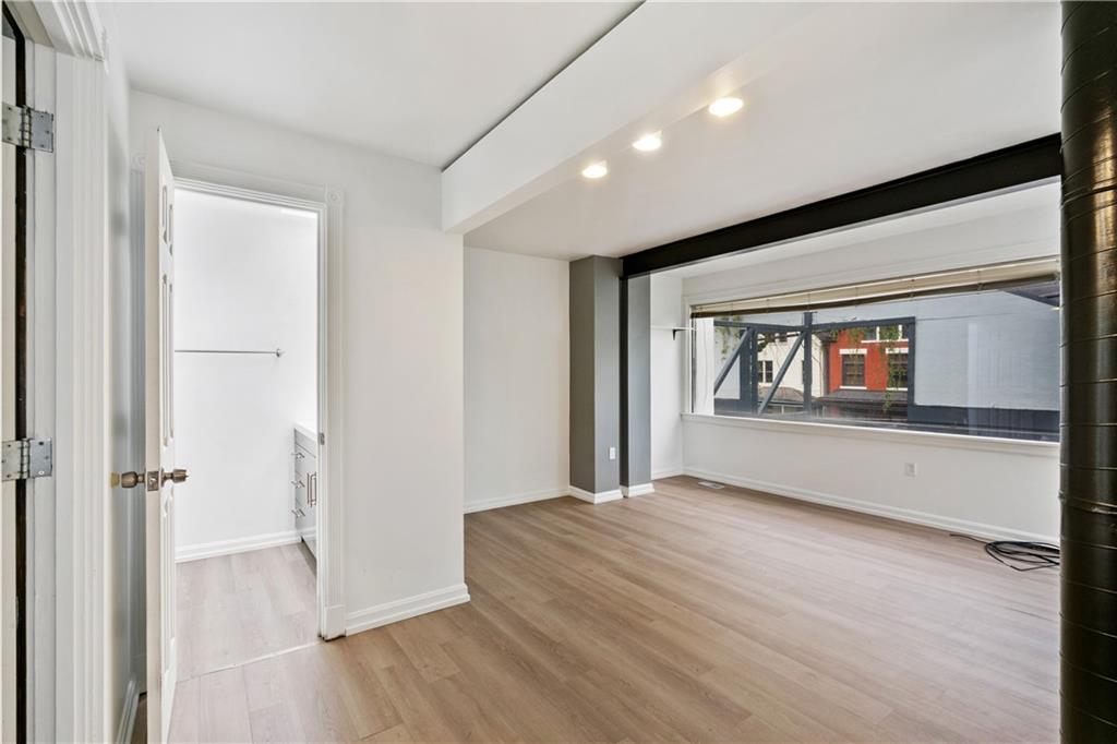 675 College Street, Unit A Pittsburgh, PA 15232 - Photo 14 of 28 a big room with wooden floor and windows